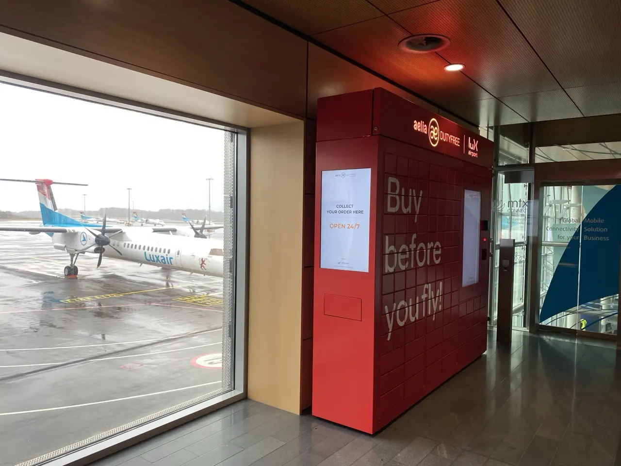 Vending machine installed airside at Luxembourg airport with Luxair on the tarmac